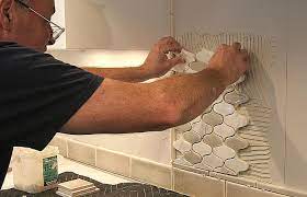 Before you set the next section, use a synthetic scrubbing pad to clean the tile, then wipe it with a dampened sponge. Installing Mosaic Tile Fine Homebuilding