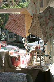 Sewn With Grace Garden Gate Cafe Window Cafe Window Boutique Window Displays Summer Window Display