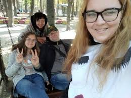 They were lying there side by side.'' The life and death of a family of  eight whose graves were found in Izium