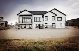 Black And White House Exterior Modern Modern Rustic White Farmhouse Black Doors Black Trim Stone Board And Baton And Siding Black Met House Exterior Farmhouse Exterior White Farmhouse Exterior