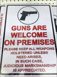 Guns are welcome on premises sign. Guns Welcome On Premises Fixtures Close Up