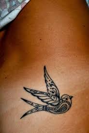 Click here for more tattoo designs and tattoo ideas tags: Peace Dove Tattoo On Girl Lower Back