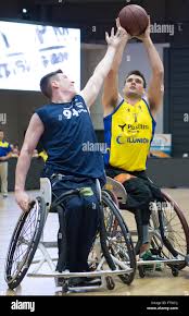 Hamburg, Germany. 12th Mar, 2016. Bill Latham (R) from CD Ilunion and  George Bates from Porto Torres vie for the ball during the EuroLeague  wheelchair basketball qualifier match between CD Iluion and