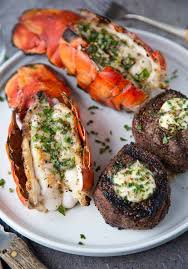 Rub both sides of the steaks with a little bit of extra virgin olive oil then generously season each side remove steaks to a plate to rest while you prepare the rest of the dish. Surf And Turf On The Grill With Herb Compound Butter Vindulge