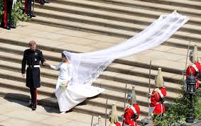 Meghan's marriage to prince harry took place in windsor on may 19, 2018 and there was a lot of speculation about her wedding dress beforehand. Lace And Long Trains Here S How Meghan Markle S Wedding Dress Compared To Kate Middleton S Meaww