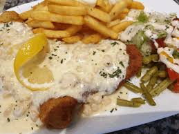 Sauce in eine auflaufform gießen, schnitzel darauf legen. Startseite Schnitzel Haus Rheinhausen