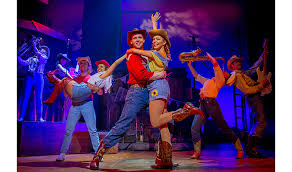 A city teenager moves to a small town where rock music and dancing have been banned, and his. Footloose The Musical Review