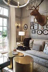 Coasters, wall art, blankets, sculptures, and lodge decorating accessories featuring whitetail and mule deer. A Hunters Dream Living Room Combining Gallery Wall And Deer Head H Ryan Studio Country Style Living Room Farmstyle Living Room Farm House Living Room