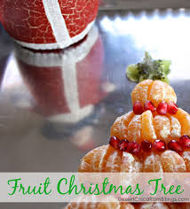 Insert many wooden toothpicks all over the pineapple and pear, fairly deep in so that they won't show through the fruit once you have placed it on. Fruit Christmas Tree Desert Chica