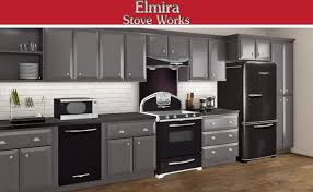 Textured Black Appliances Compliment The Charcoal Colored Cabinets For A More Modern Feel To A Retro Kitchen Or Bache Kitchen Restoration Retro Kitchen Kitchen