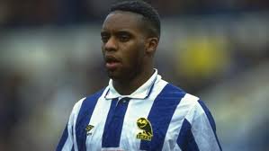 Dalian atkinson of aston villa sits on the pitch during a match in december 1993 [file: Bjocjtroc9eslm