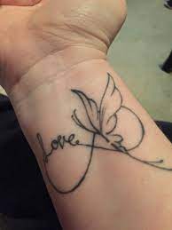 Outline Love Butterfly Tattoo On Wrist Butterfly Wrist Tattoo Small Tattoos Butterfly Tattoo
