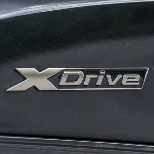 The BMW xDrive badge signifying intelligent all-wheel drive., AI generated