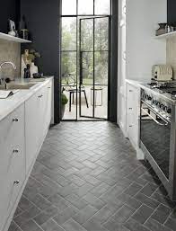 Natural stone tiles for your kitchen floor is a very classic choice and give a real sense of grandeur and stature to your space. 7 Scandinavian Kitchen Floor Tile Ideas That Ll Inspire You To Embrace Both Color And Pattern Hunker Kitchen Flooring Kitchen Floor Plans Kitchen Remodeling Projects