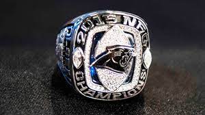 Panthers football (cam newton) 2015 nfc world champions (keep pounding) super bowl 50 collectible replica silver championship ring with cherrywood display box. Panthers Receive Nfc Championship Rings