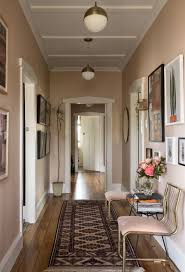 A longstanding theory is that the style can be traced from africa to haitian influences on house design in new orleans, but the houses can be found as far away as key west and ybor city in florida, and texas, and as far north as chicago, illinois. Michelle Matangi S Plush Pink Walled Bungalow In Suburban New Zealand Architectural Digest Bungalow Hallway Ideas Hallway Wall Colors Pink Hallway