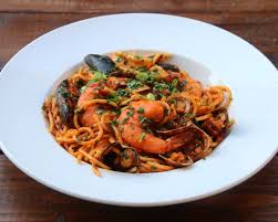 Latin Style Seafood Spaghetti Recipe Or Tallarines Con Mariscos Made With A Mix Of Seafood Cooked In A Sauce Of Tomato Spaghetti Recipes Seafood Pasta Dishes