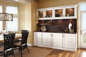 Drawer and door pulls are a unique wood and metal combination with the center metal area finished in an antiqued nickel. Eating Nook Dining Room Storage Furniture Dining Room Small Dining Room Storage Cabinet