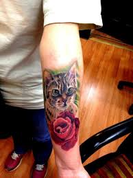 If you decide to get a cat tattoo as a sort of memorial to your cat, then you can add in more elements, such as flowers, to show how much that particular cat means to you. Cat Memorial Color Portrair Tattoo By Cesar Perez Tattoos Tattoonow