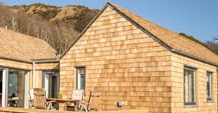 Vertical shingle tile alignment is created by opening guide slots in the top of the shingle strip into which the next course is engaged. How To Install Cedar Shingles Roofing Superstore Help Advice