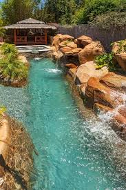 Hgtv Com Loves This Lagoon Style Pool With Tropical Plantings Stacked Stone Waterfall And Authentic Shipwreck Dream Pools Backyard Pool Pool Landscaping