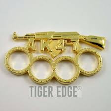 Maybe you would like to learn more about one of these? Brass Knuckle Gold Ak 47 Rifle Paperweight Ak47 Gun Biker