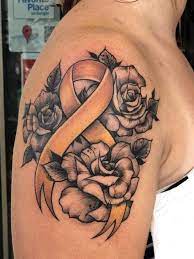 Cancer ribbon tattoos are near the top of the rankings when it comes to meaningful tattoo designs since there are so many people out there that want to the cancer ribbon tattoo is used with various colors to identify victims and survivors of cancer. Pin By Crystal Hough On Tattoos Cancer Tattoos Cancer Ribbon Tattoos Pink Ribbon Tattoos