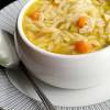 Transfer the orzo to a large wide bowl and toss until the orzo cools slightly. 3