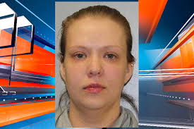 Woman charged with battering man