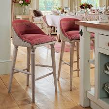 It is a barstool that has got a gibson logo on the seat, black vinyl upholstery and swivel function. Jaisalmer Stripe Upholstered Bar Stool Susie Watson Designs Susie Watson Designs