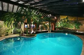 50 Indoor Pool Ideas Swimming In Style Any Time Of Year Indoor Swimming Pools Tropical Pool Landscaping Luxury Swimming Pools