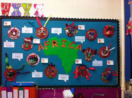 Africa Display African Masks Made By The Children And Interactive Panels With Questions And Facts About Africa Classroom Displays Africa African Masks