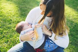 But it's not always easy. Breastfeeding Baby Pulling Mom S Hair Stock Photo Offset