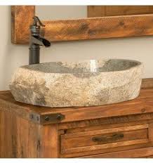 The oversized farmhouse sink exposed lightbulbs and stone floating vanity give the bathroom a retro, almost industrial feel. Copper Vessel Sink Packages For Rustic Bathroom Vanities