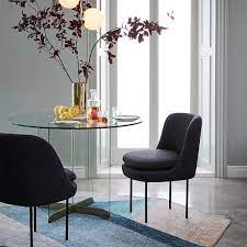 This modern black and grey dining chair set, which includes two chairs, features grey upholstery on the seat cushions. Modern Curved Upholstered Dining Chair Leather Dining Chairs Dining Chairs Glass Dining Table