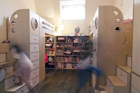 a symmetrical storage heaven for sisters kids shared bedroom shared kids room shared room