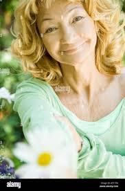 Handing flowers hi-res stock photography and images