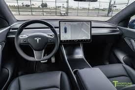 An additional package is available to customers which includes a panoramic roof, wood trim, leather upholstery, a premium audio system with 12 speakers. Custom Tesla Model Y Interior T Sportline Tesla Model S 3 X Y Accessories