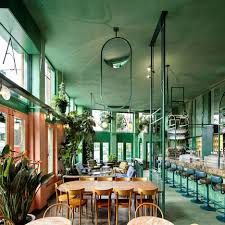 rainforest foliage and mirrors feature inside amsterdam bar by studio modijefsky restaurant interieur restaurant interieurontwerp interieur ontwerpen