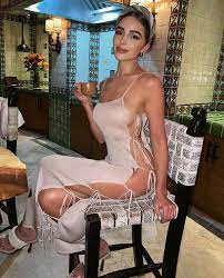 Olivia Culpo Pokes Fun at American Airlines 'Cover Up' Drama in Nearly  Naked Dress