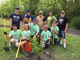 Science Olympiad team plants trees at Whitehall Parkway