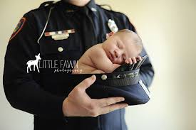 I Want Levi To Do This With Little Man Police Newborn Little Fawn Photography Gallipolis Ohio Newborn Police Police Baby Newborn Photoshoot
