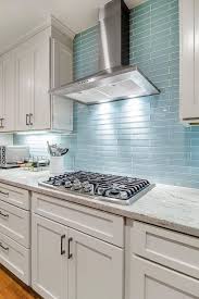 Today many designers, including waterworks cofounder and author barbara sallick, are favoring tile envelopes in which backsplash tile covers the entire wall. 17 Awe Inspiring Blue Kitchen Backsplash Ideas You Can Steal Blue Backsplash Kitchen Glass Tile Backsplash Kitchen Glass Tiles Kitchen