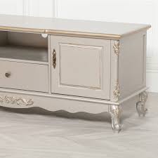 A rustic shabby chic kitchen in neutrals, with a white cabinet with baskets, a curtain over a cabinet, open storage units and vintage linens. French Antique Silver Large Cabinet Tv Unit Glasstone Furniture
