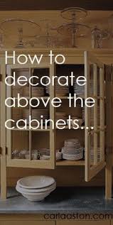 How To Decorate The Top Of A Cabinet And How Not To Designed Decorating Above Kitchen Cabinets Home Decor Above Kitchen Cabinets