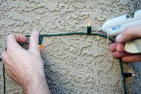 How To Hang Christmas Lights On Stucco Hunker Hanging Christmas Lights Exterior Christmas Lights Indoor Christmas Lights