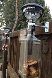Out Door Solar Lighting Using Jack Daniels Bottles Works Great On The Patio Lights Up The Night Adellesa Jack Daniels Bottle Solar Lights Bottle Chandelier
