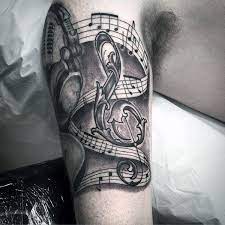 Music notes tattoo designs are the most common type of music tattoo, you can have them in any size you want. Aufwandige Music Note Kopfhorer Jungs Inner Arm Tattoos Tattoo Designs Men Tattoos For Guys Music Notes Tattoo