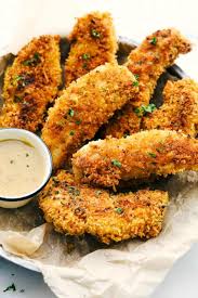 Delicious Chicken Tenders Breaded In A Garlic Parmesan Panko Mixture And Baked Chicken Tender Recipes Baked Parmesan Chicken Tenders Chicken Tenderloin Recipes