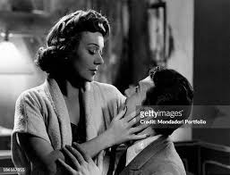 French actress Edwige Feuillère looking tenderly French actor Frank... News  Photo